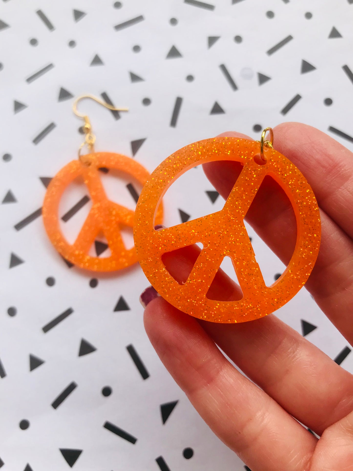 Orange Glittriga Peacetecken
