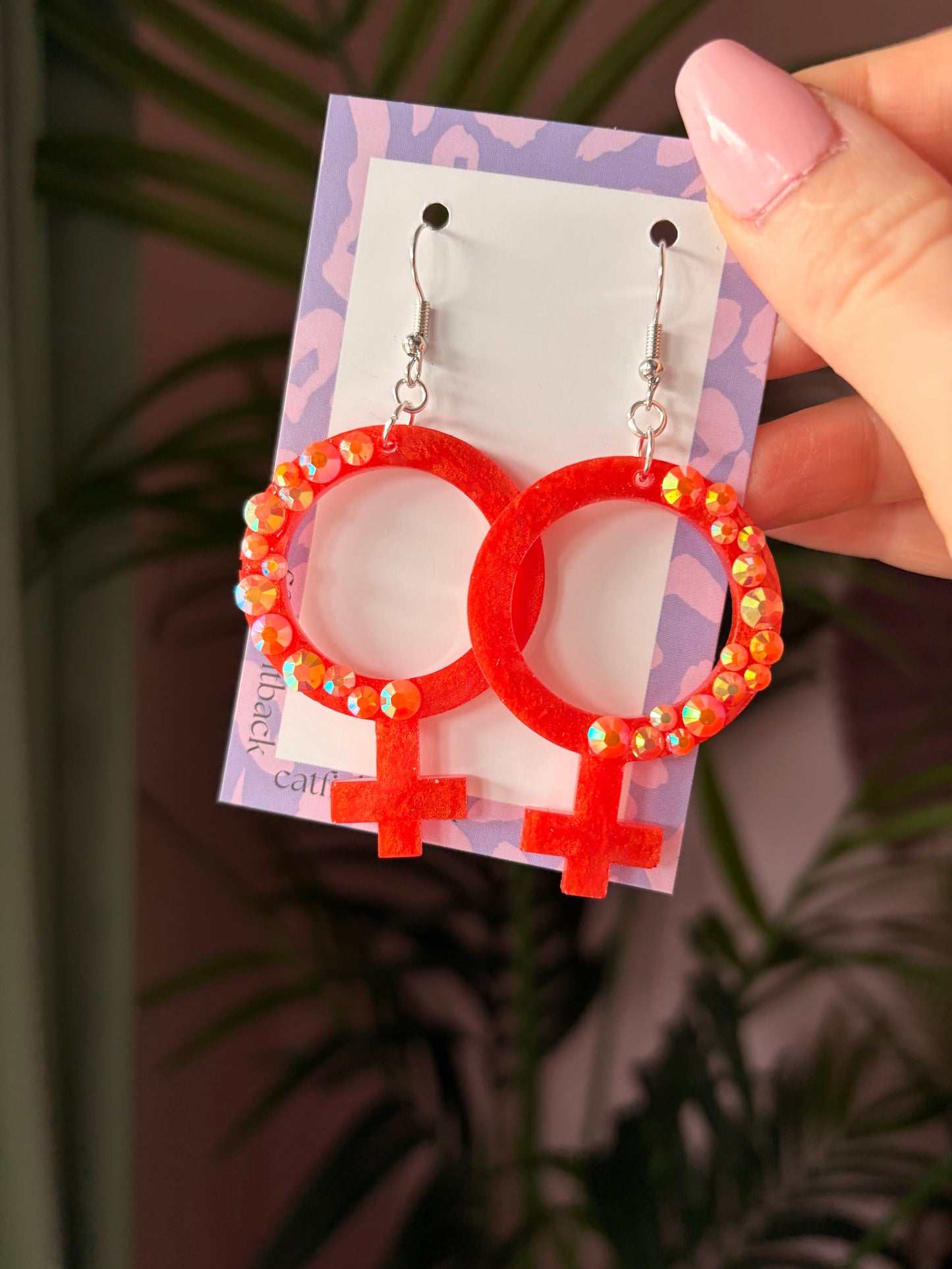 Orange Kvinnotecken med Rhinestones