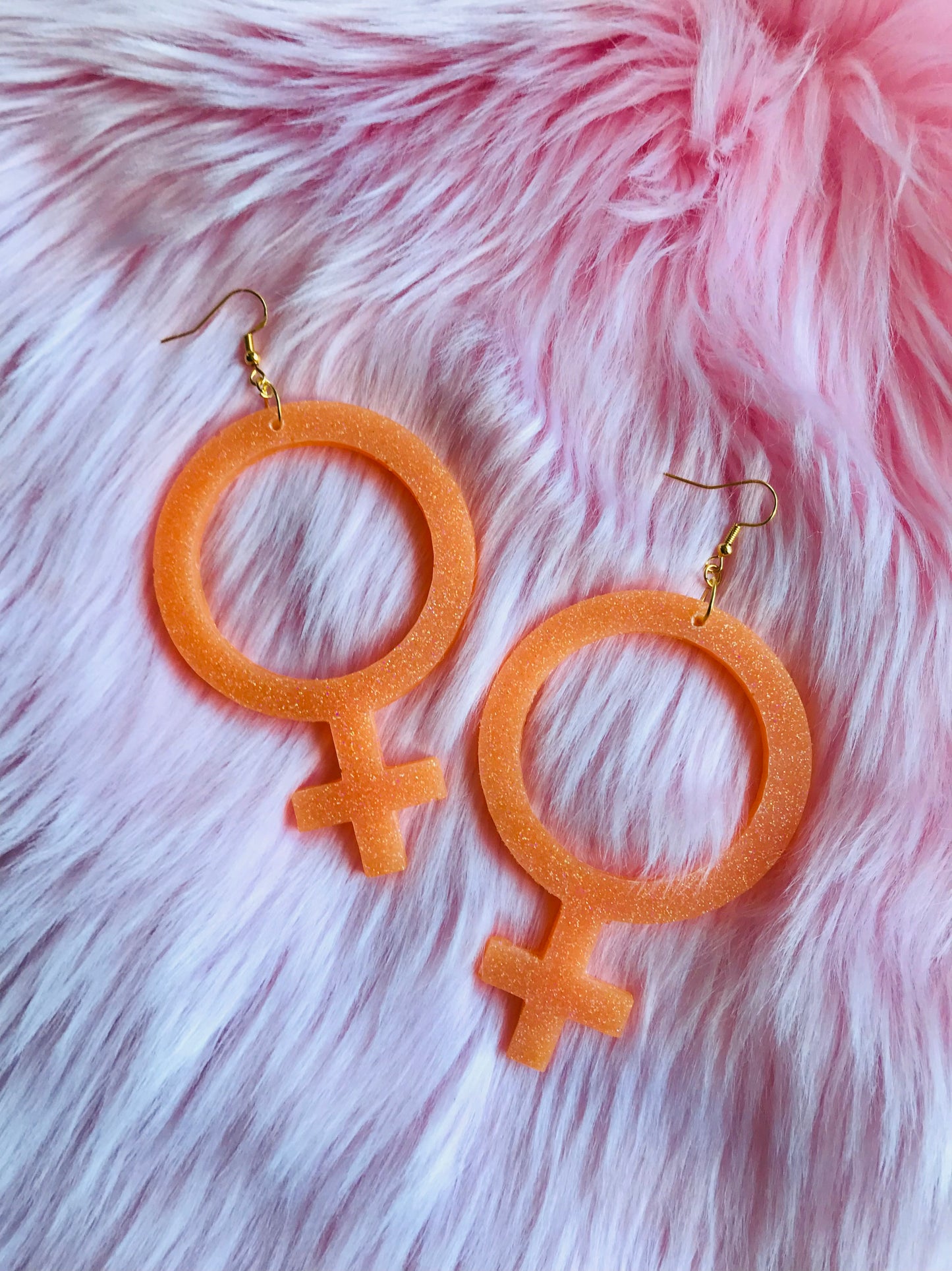 Glittriga Orange Kvinnotecken