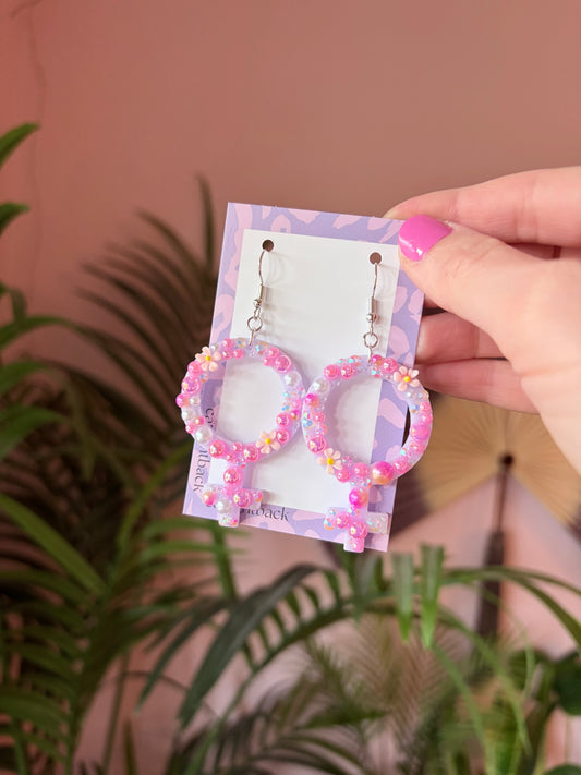 Rosa Kvinnotecken med Rhinestones och Blommor
