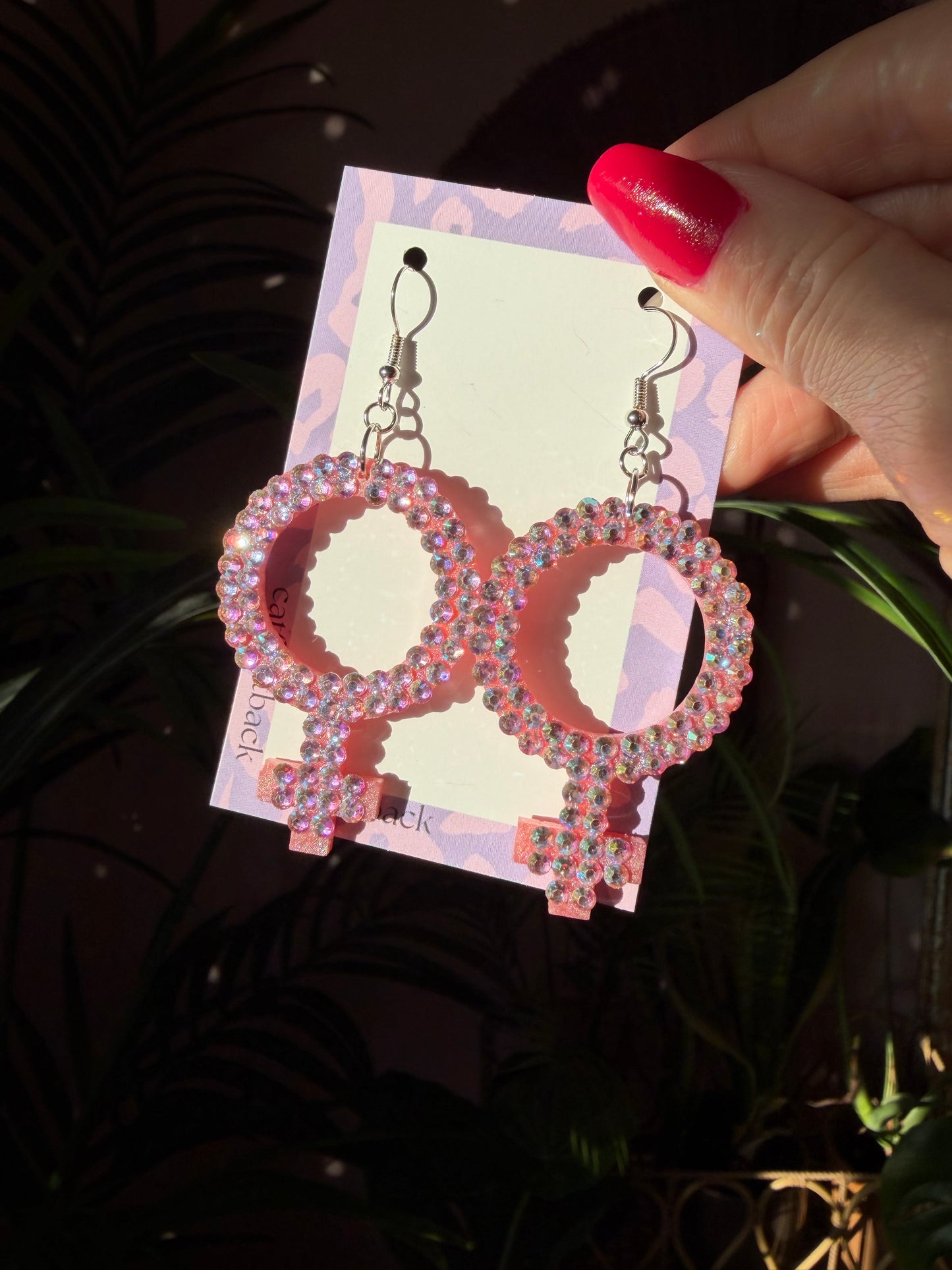 Rosa Kvinnotecken med Rhinestones