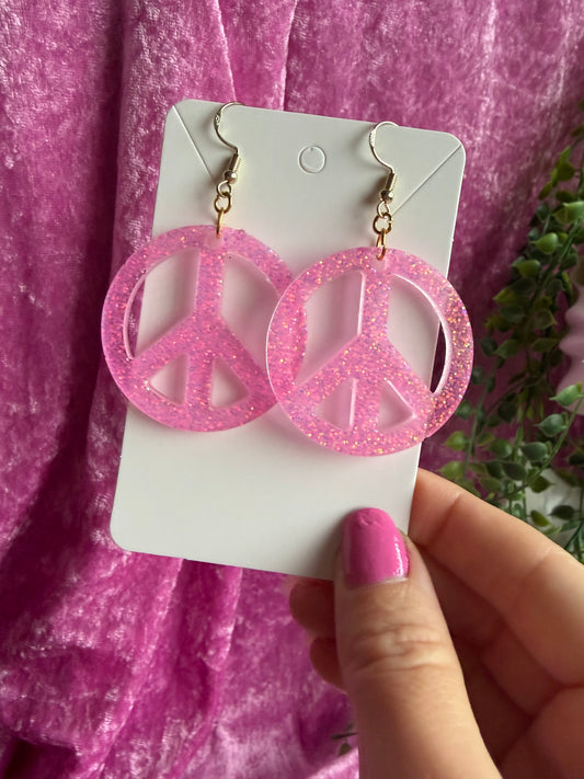 Glittriga rosa peacetecken