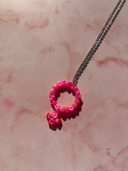 Halsband med kvinnotecken