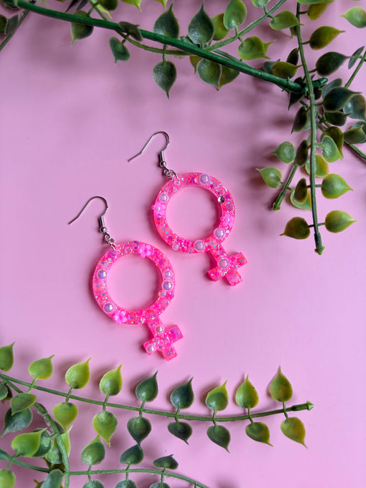 Rosa Kvinnotecken med Blommor och Rhinestones