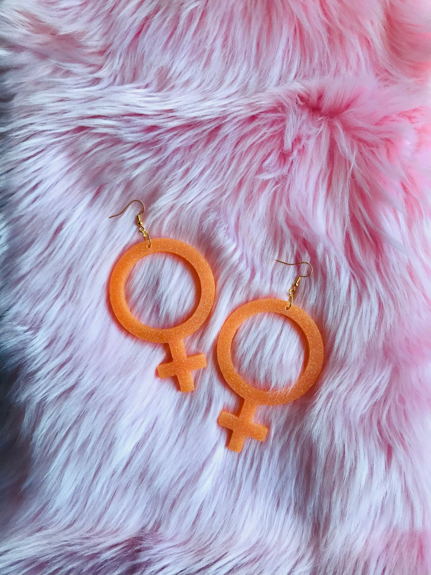 Glittriga Orange Kvinnotecken