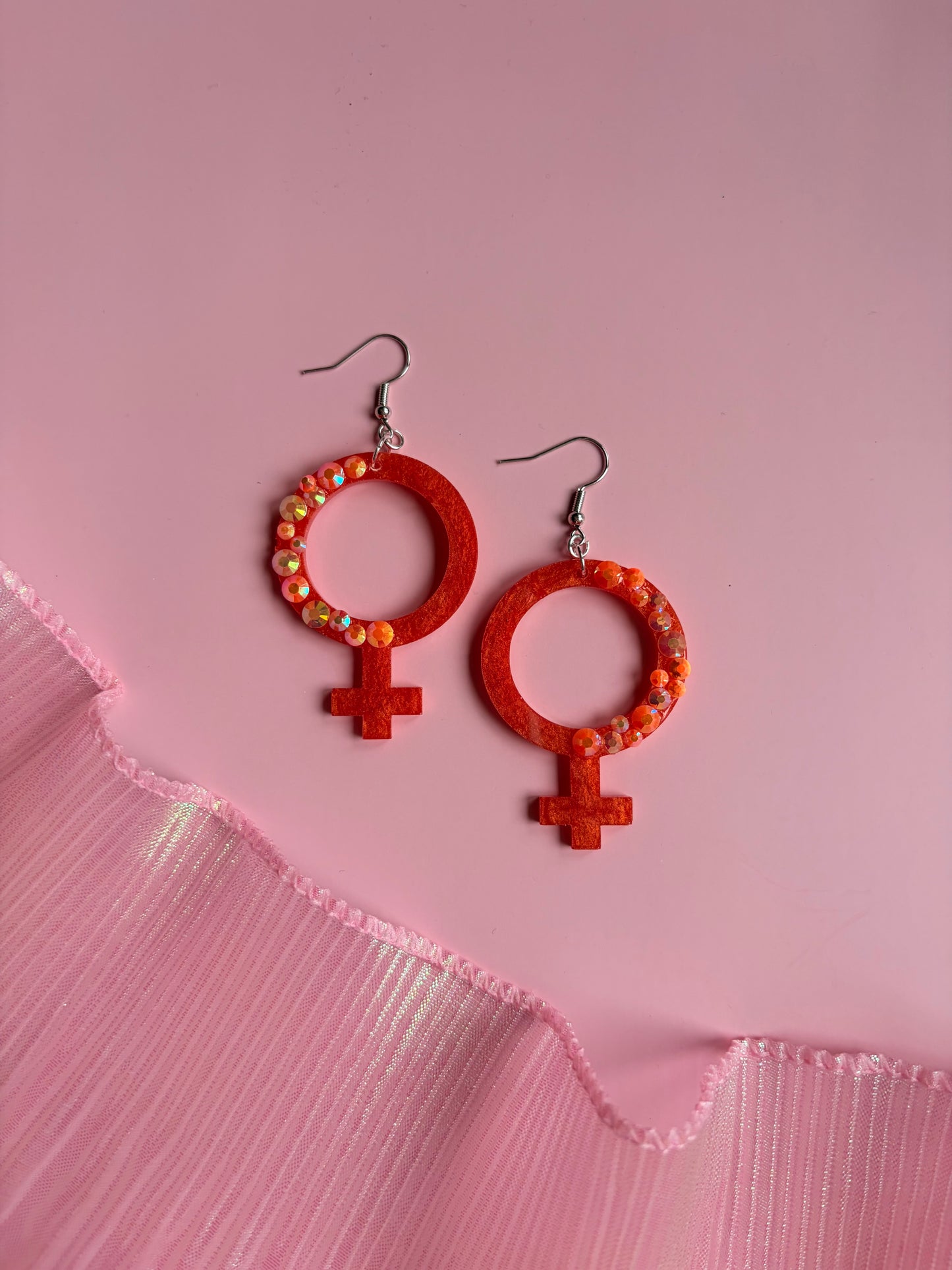 Orange Kvinnotecken med Rhinestones