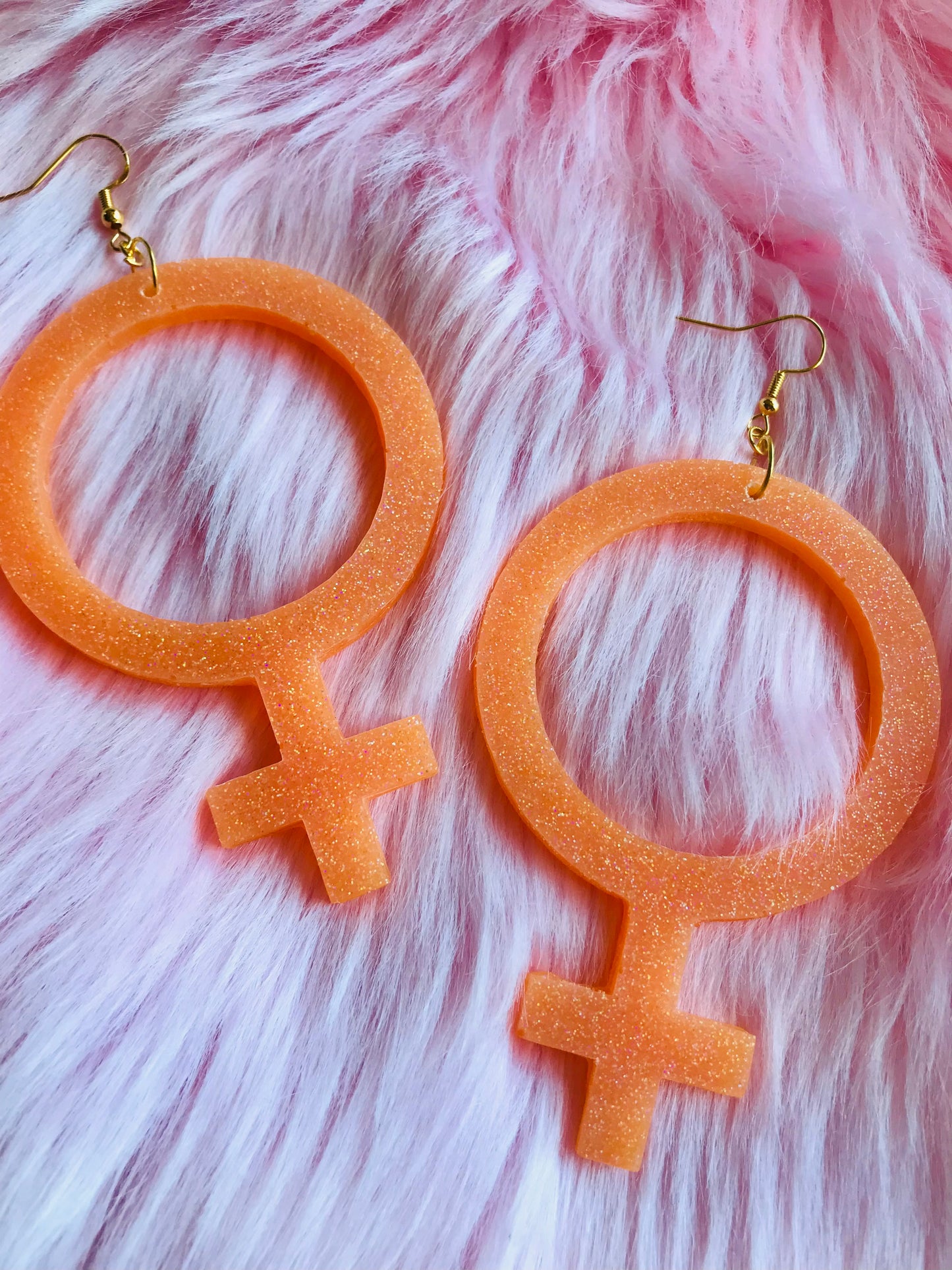 Glittriga Orange Kvinnotecken
