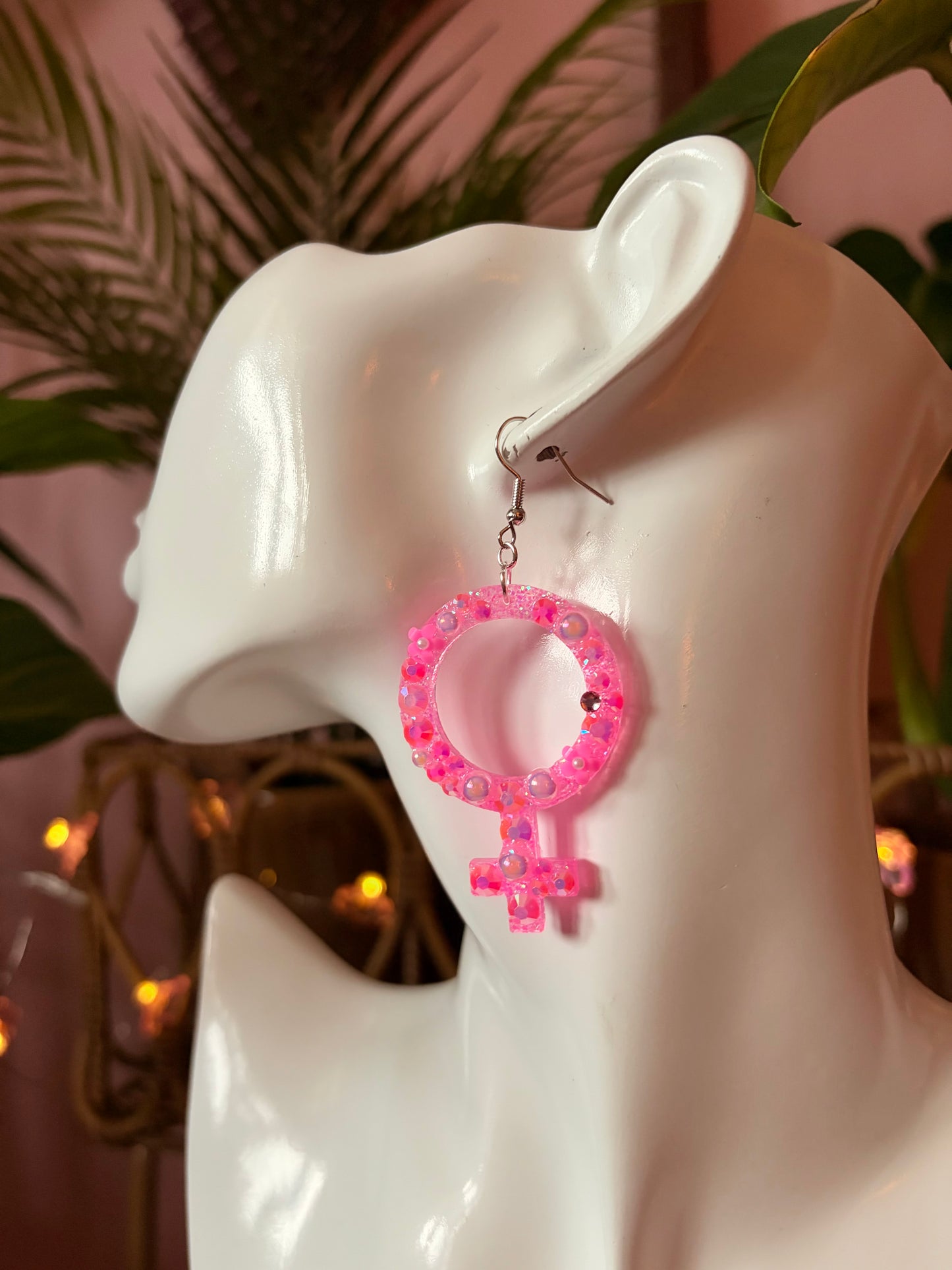 Rosa Kvinnotecken med Blommor och Rhinestones