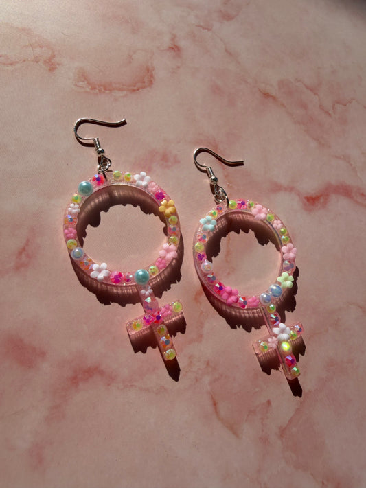 Rosa Kvinnotecken med Rhinestones och Blommor