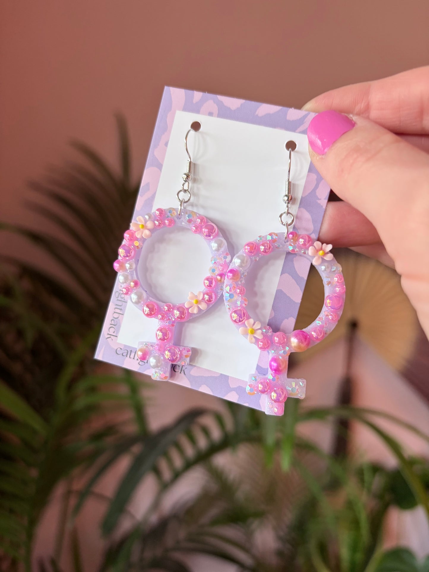 Rosa Kvinnotecken med Rhinestones och Blommor