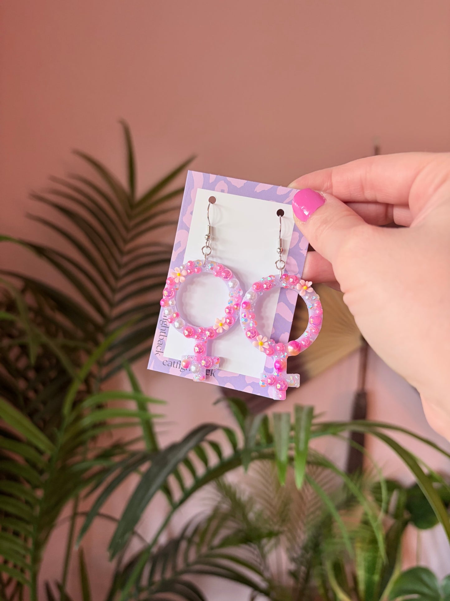 Rosa Kvinnotecken med Rhinestones och Blommor