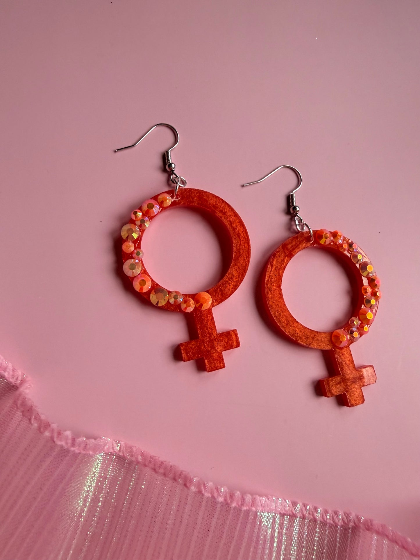 Orange Kvinnotecken med Rhinestones